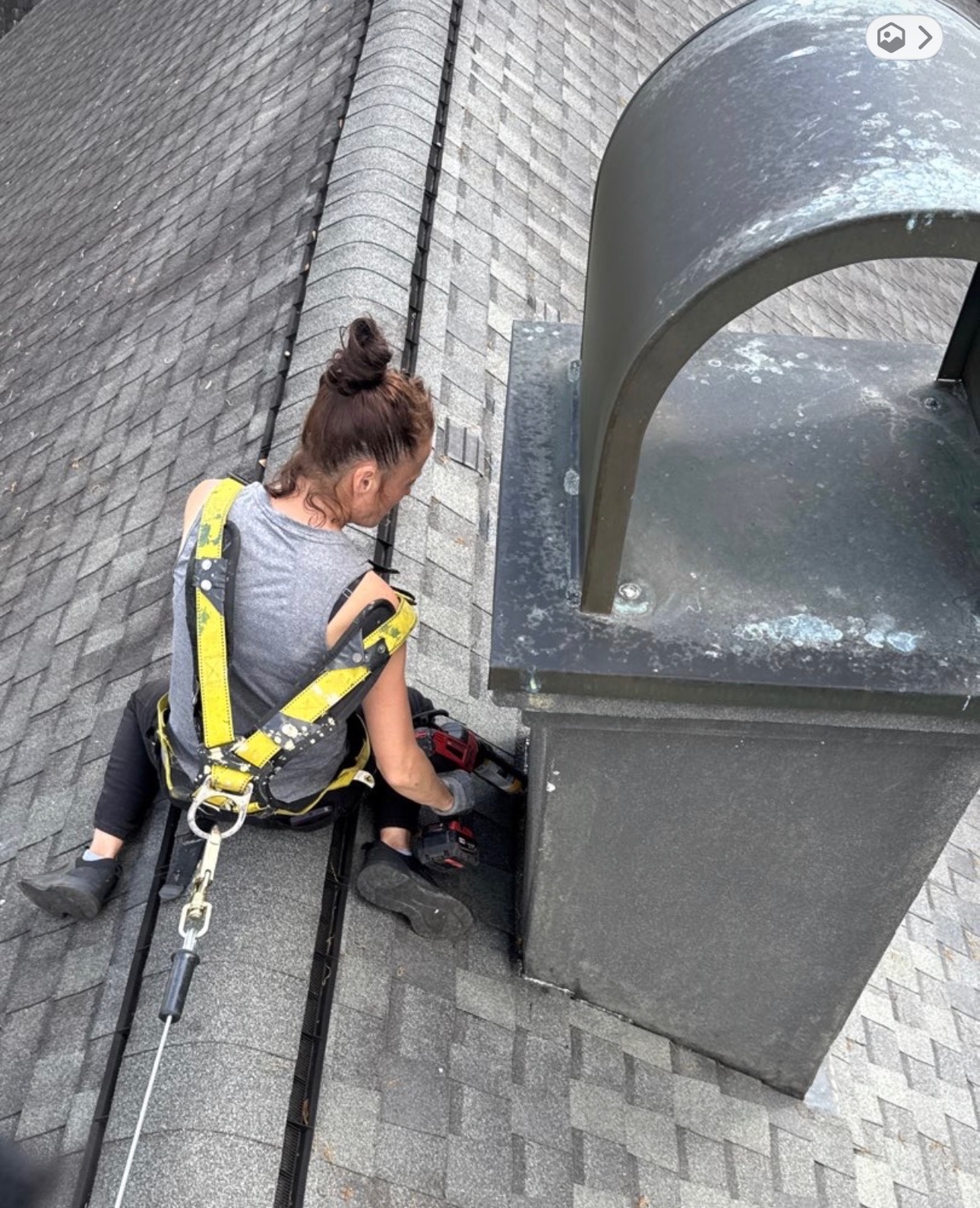 Professional roofer repairing shingles on Louisiana home