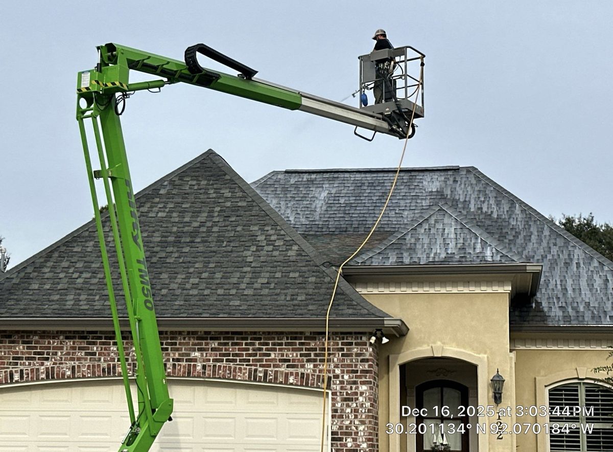 Professional roofing contractor working on Louisiana home